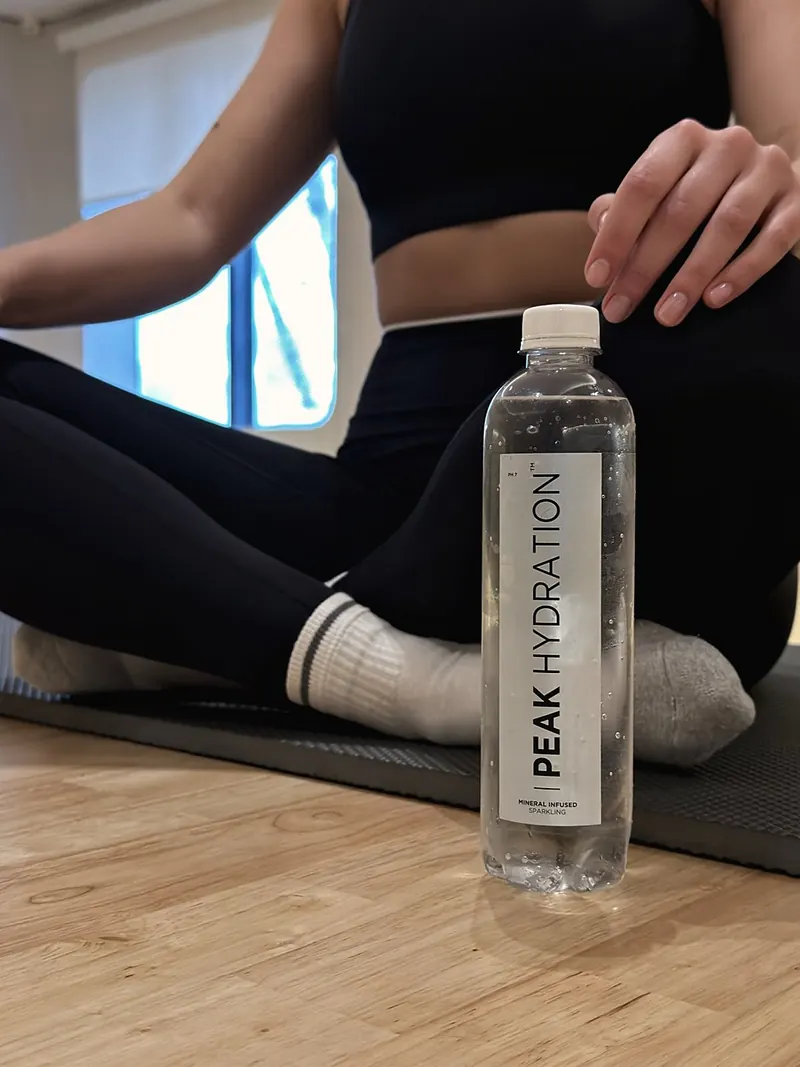 Peak Hydration beside the mat after a studio session